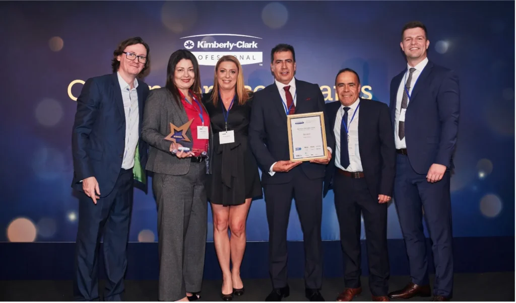 An image of the key enviro team accepting their awards at the Kimberley Clark Gold Service Awards